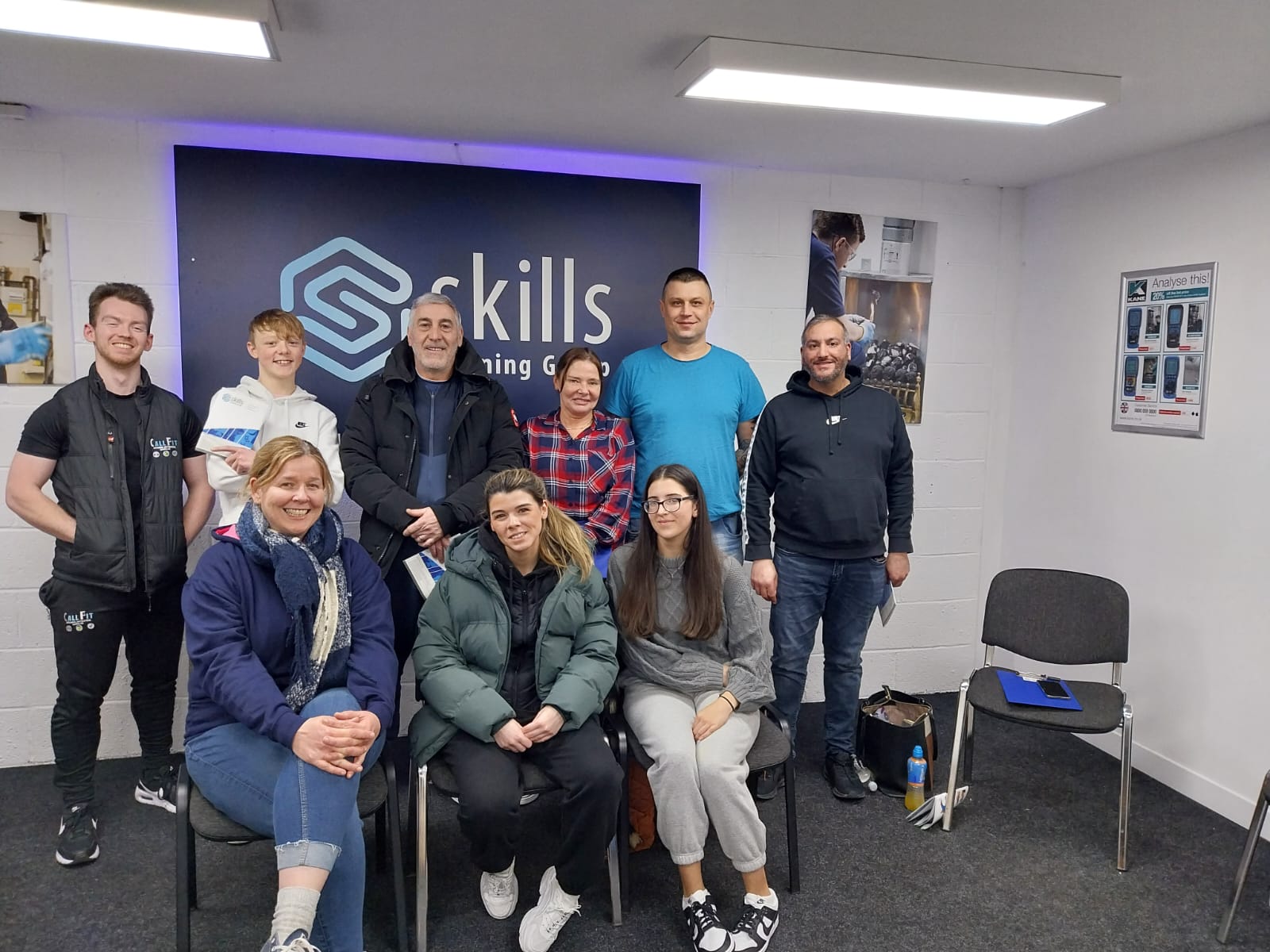 A group of learners and their trainer pictured at Skills Training Group